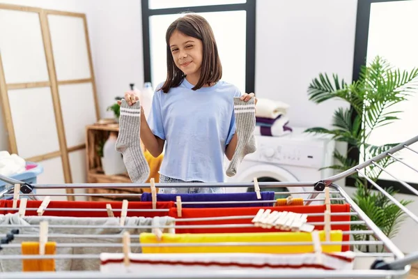 Young Hispanic Girl Hanging Socks Clothline Winking Looking Camera Sexy — Fotografia de Stock