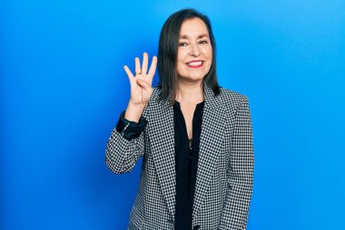 Middle age hispanic woman wearing business clothes showing and pointing up with fingers number four while smiling confident and happy. 