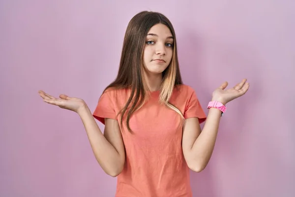Teenager Girl Standing Pink Background Clueless Confused Expression Arms Hands — Stock Photo, Image