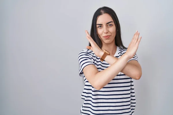 Young Brunette Woman Wearing Striped Shirt Rejection Expression Crossing Arms — ストック写真