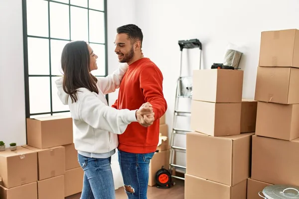 Young Latin Couple Smiling Happy Dancing New Home — Stock Photo, Image