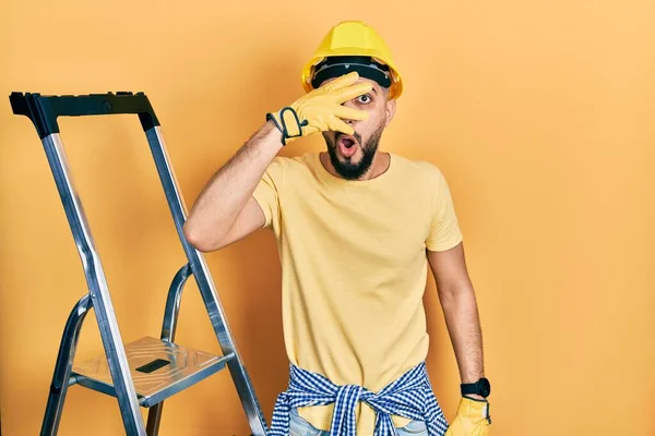 Handsome Man Beard Construction Stairs Wearing Hardhat Peeking Shock Covering — Stockfoto
