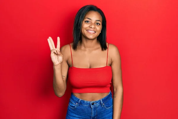 Young African American Girl Wearing Casual Style Sleeveless Shirt Showing — Zdjęcie stockowe