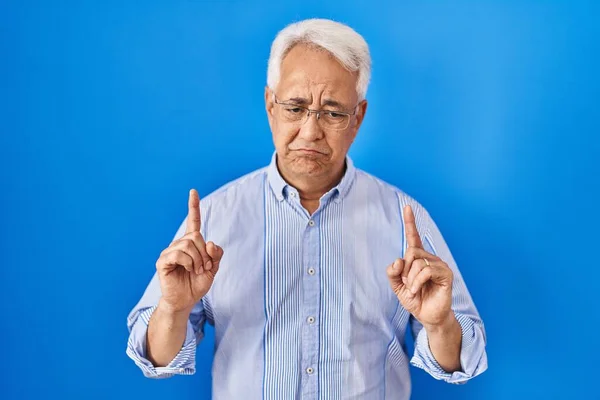 Hispanic Senior Man Wearing Glasses Pointing Looking Sad Upset Indicating — Stock Photo, Image