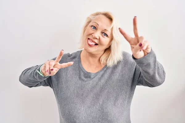 Middle Age Caucasian Woman Standing White Background Smiling Tongue Out — Zdjęcie stockowe