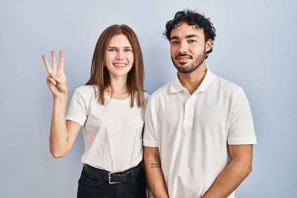 Young Couple Wearing Casual Clothes Standing Together Showing Pointing Fingers — 图库照片