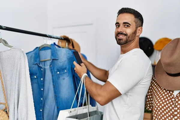 Young Hispanic Man Customer Choosing Clothes Make Photo Shirt Clothing — Stock Fotó