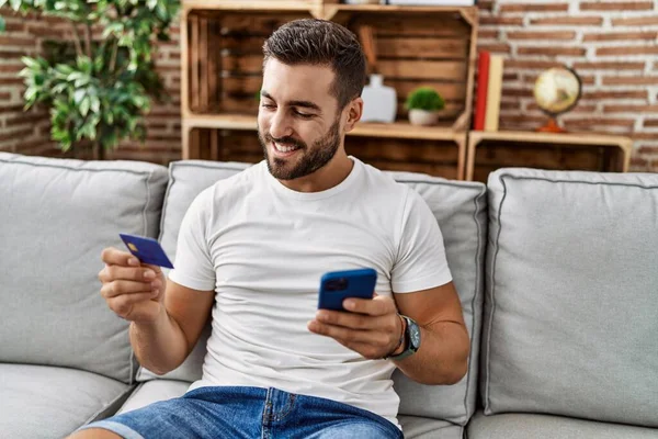 Young Hispanic Man Smiling Confident Using Smartphone Credit Card Home — Photo