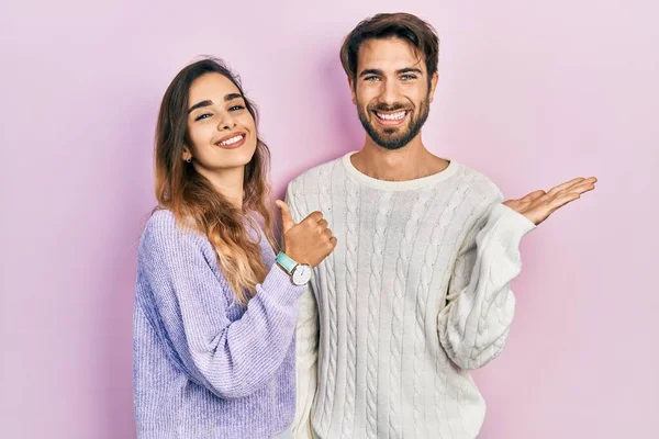 Young Hispanic Couple Wearing Casual Clothes Showing Palm Hand Doing — 스톡 사진