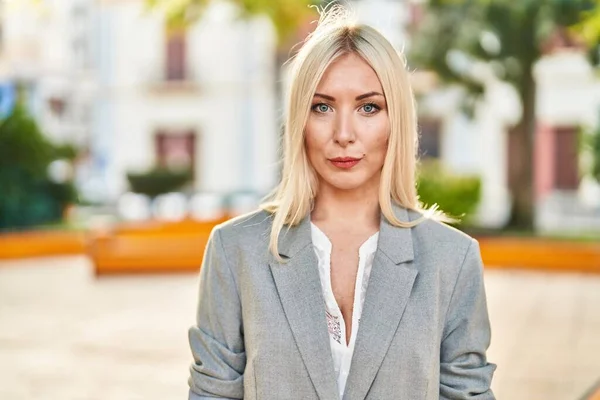 Young Blonde Woman Standing Relaxed Expression Park — Stok fotoğraf