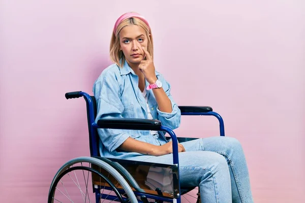Beautiful Blonde Woman Sitting Wheelchair Pointing Eye Watching You Gesture — Stok fotoğraf