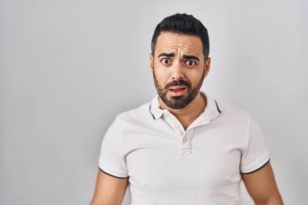 Young Hispanic Man Beard Wearing Casual Clothes White Background Shock — Zdjęcie stockowe