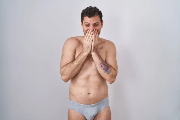Young Hispanic Man Standing Shirtless Wearing Underware Laughing Embarrassed Giggle — Stockfoto