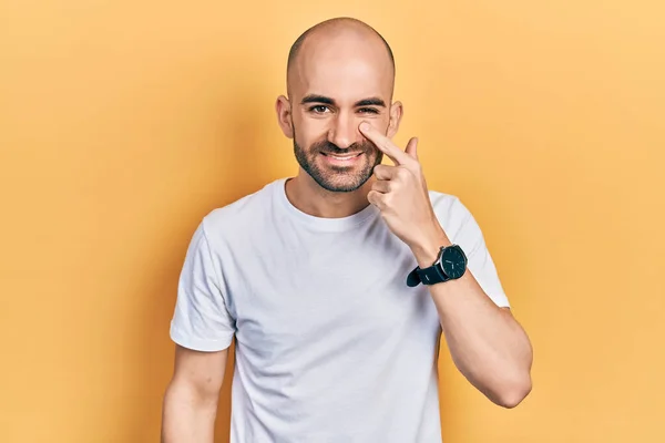 Young Bald Man Wearing Casual White Shirt Pointing Hand Finger — Stockfoto