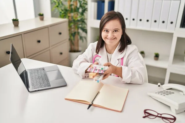 Hispanic Girl Syndrome Wearing Doctor Uniform Stethoscope Holding Pills Smiling — Stock Photo, Image