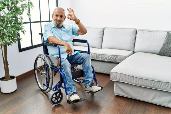 Handsome Senior Man Sitting Wheelchair Living Room Smiling Positive Doing — Stockfoto