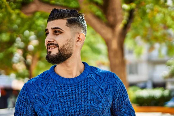 Young arab man smiling confident at park