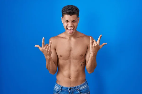 Young Hispanic Man Standing Shirtless Blue Background Shouting Crazy Expression — Zdjęcie stockowe