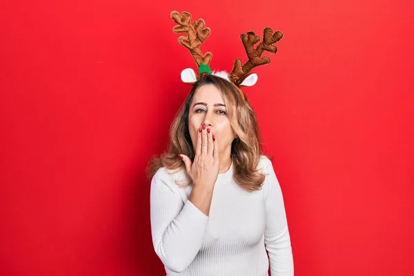Middle Age Caucasian Woman Wearing Cute Christmas Reindeer Horns Bored — Stockfoto
