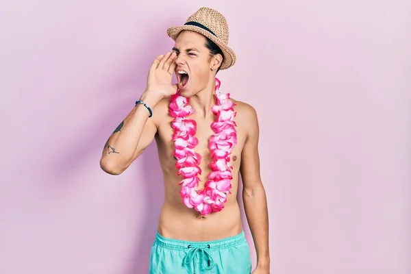 Young Hispanic Man Wearing Swimwear Summer Hat Shouting Screaming Loud — Stockfoto