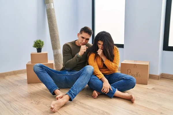 Young Couple Sitting Floor New Home Feeling Unwell Coughing Symptom — Stock Photo, Image