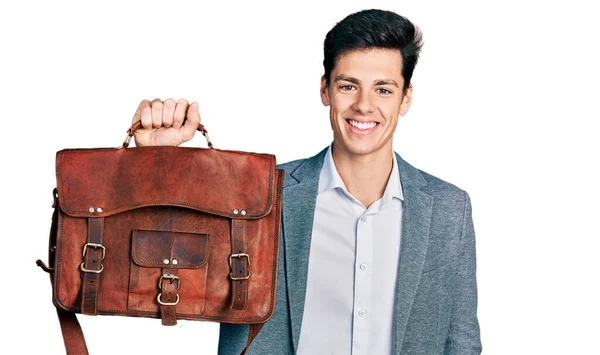 Joven Hombre Hispano Sosteniendo Bolsa Negocios Con Aspecto Positivo Feliz — Foto de Stock