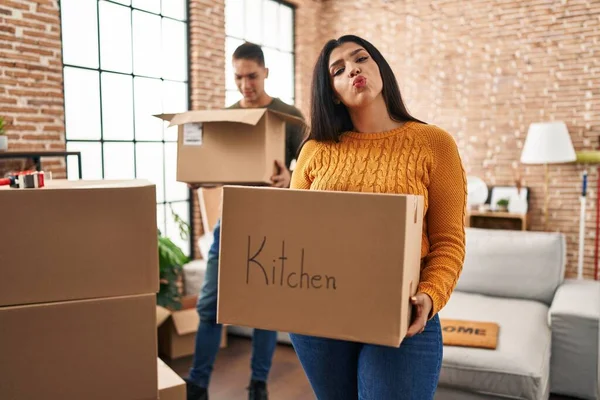 Young Couple Moving New Home Cardboard Boxes Looking Camera Blowing — Stock Photo, Image