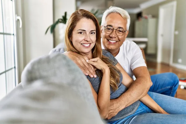 Middle Age Hispanic Couple Smiling Happy Hugging Sitting Sofa Home — Stock Photo, Image
