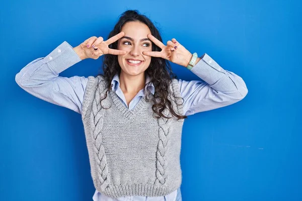 Young Brunette Woman Standing Blue Background Doing Peace Symbol Fingers — 스톡 사진