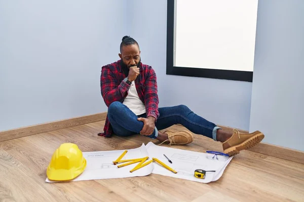 African American Man Sitting Floor New Home Looking Blueprints Feeling — Stock Photo, Image