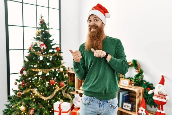 Redhead Man Long Beard Wearing Christmas Hat Christmas Tree Pointing — Photo