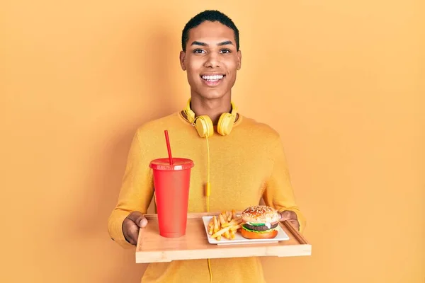 Young African American Guy Eating Tasty Classic Burger Smiling Happy — Photo