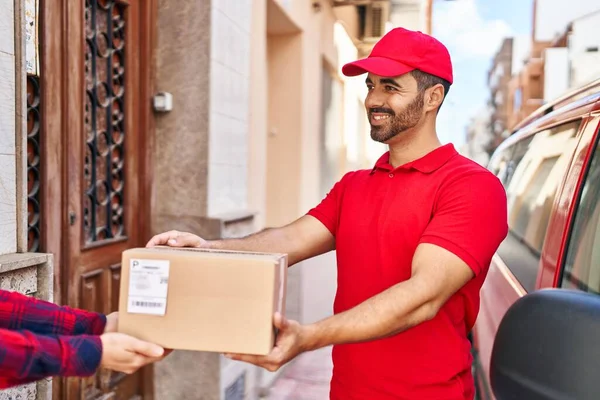 Young Hispanic Man Courier Giving Package Street — Stock Fotó