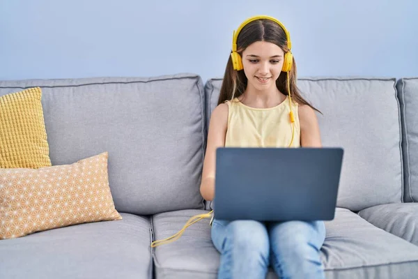 Adorable Girl Using Laptop Sitting Sofa Home — Stockfoto
