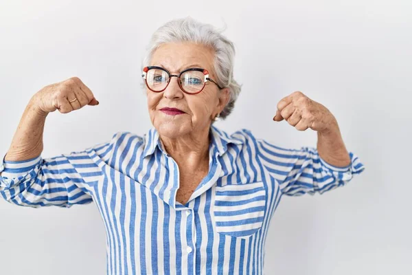 Senior Woman Grey Hair Standing White Background Showing Arms Muscles —  Fotos de Stock