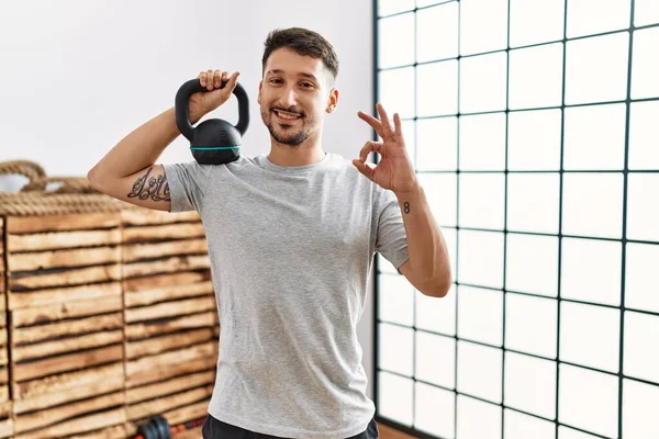 Young Handsome Man Wearing Sportswear Using Dumbbells Doing Sign Fingers — Photo