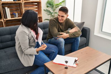 Man and woman having psychology rorscharch test at clinic