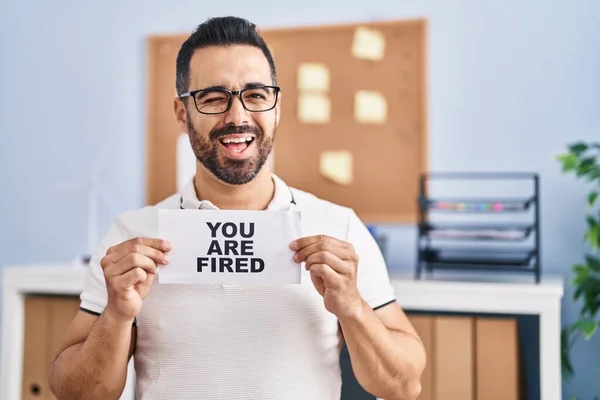 Young Hispanic Man Beard Holding You Fired Banner Office Winking — Stock Photo, Image