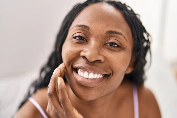 African American Woman Touching Face Sitting Bed Bedroom — Stockfoto