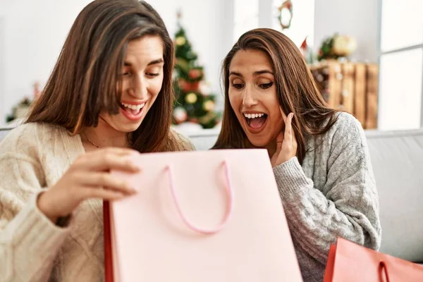 Two Women Surprise Gift Bag Sitting Christmas Tree Home — Stockfoto