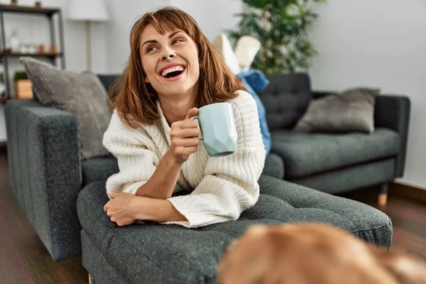 Young Caucasian Woman Drinking Coffee Lying Sofa Home — 图库照片