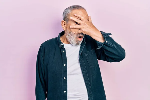 Handsome Senior Man Beard Wearing Casual Denim Shirt Peeking Shock —  Fotos de Stock