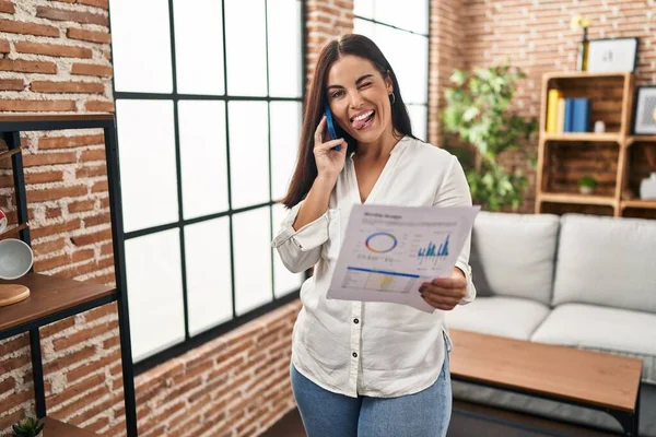 Young Hispanic Woman Speaking Phone Bills Sticking Tongue Out Happy — Stock Photo, Image