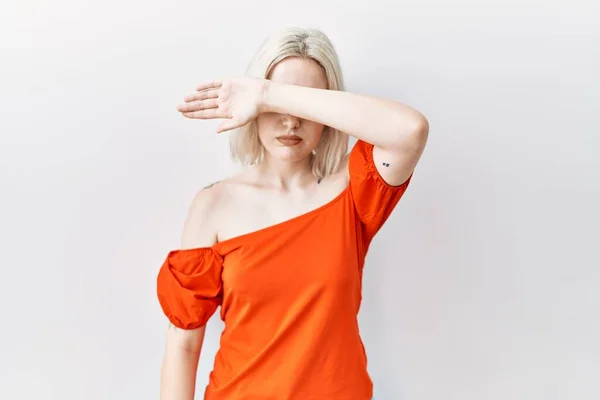 Young Caucasian Woman Standing Isolated Background Covering Eyes Arm Looking — Stockfoto