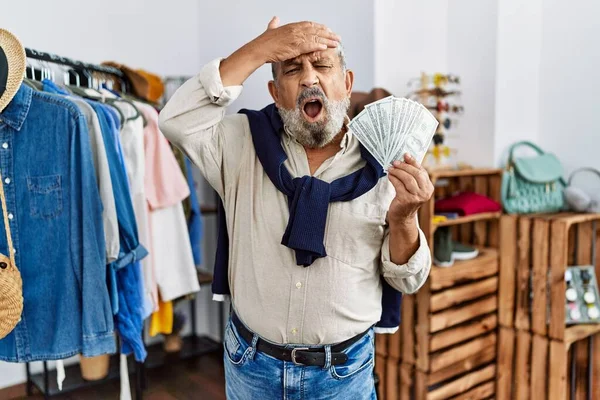 Handsome Senior Man Retail Shop Holding Dollars Banknotes Stressed Frustrated — Stockfoto