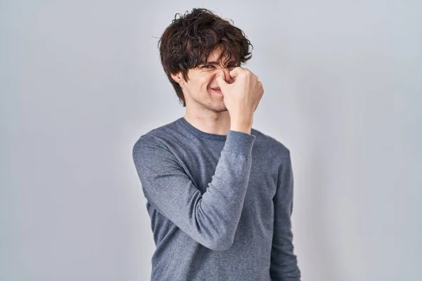 Young Man Standing Isolated Background Smelling Something Stinky Disgusting Intolerable — Photo