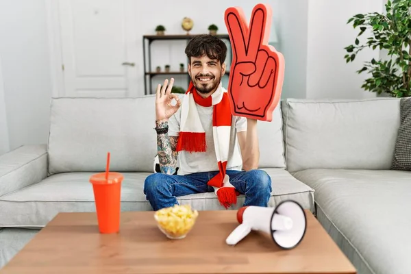 Hispanic Man Beard Supporting Football Team Home Sitting Sofa Doing — Stockfoto