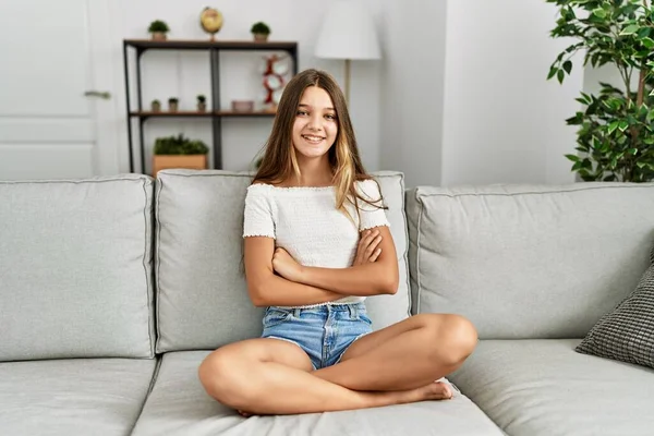 Young Brunette Teenager Sitting Sofa Home Happy Face Smiling Crossed — Stock fotografie