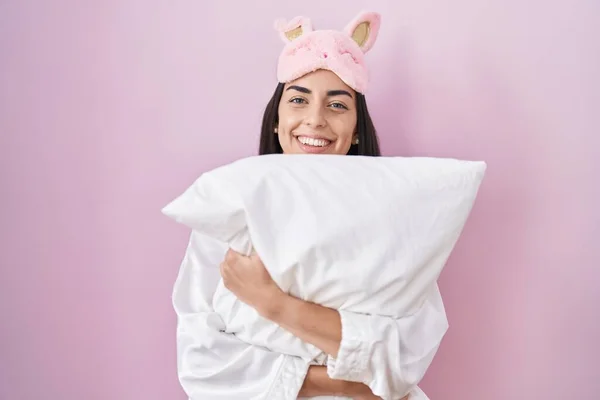 Young Brunette Woman Wearing Sleep Mask Pajama Hugging Pillow Smiling — Photo