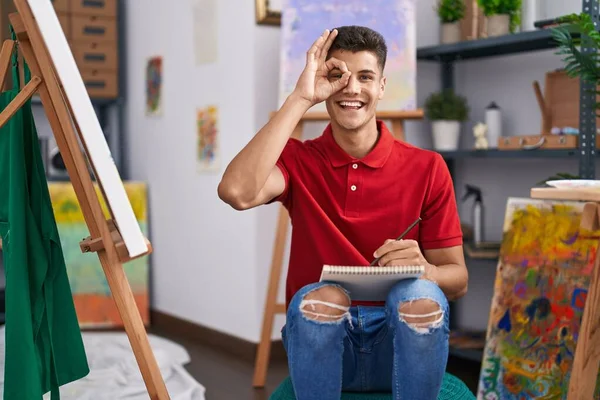Young Hispanic Man Drawing Art Notebook Smiling Happy Doing Sign — 图库照片